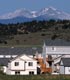 Homes in the foreground of a mountain scene