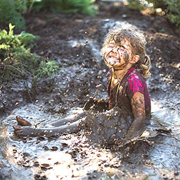 Girl playing in mud