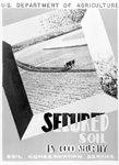 This photo depicts a January 1941 SCS poster, Secured Soil Is Good Security located in the National Archives — reference # 114G-C-9613.  (NRCS image -- click to enlarge) 