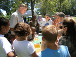 urban conservationist Skip Vetten explains to a youthful crowd that everyone can take steps to protect and enhance natural resources