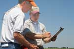 NRCS Illinois soil scientist Dr. John Doll (retired) and Chief Lancaster log soils data (NRCS photo -- click to enlarge)