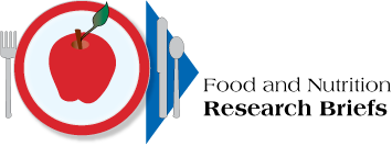 Table place setting with apple. Title: Food and Nutrition Research Briefs. Link to FNRB home page