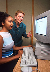 Photo of physiologist Mary Kretsch and dietician Monique Derricot at computer 