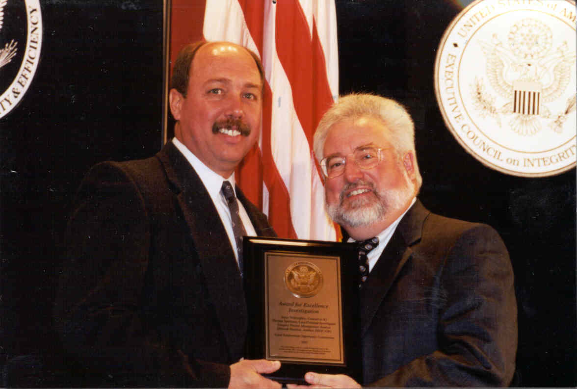 OIG Special Agent Thomas Spellman accepts an award for excellence in investigations from Barry Snyder, Chairman of the President's/Executive Council on Integrity and Efficiency.