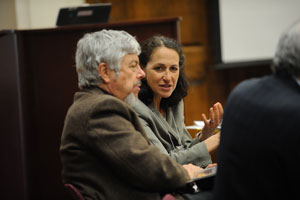 Hamburg, center, called for developing a research agenda and for quick action, noting that this was an important moment in time. In this photo, she is shown talking with Smith.