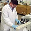 Photo of Scientist Working in Laboratory