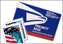 Two postal stamps and a priority mail envelope.