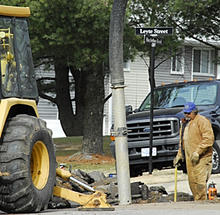 An employee with the Directorate of Public Works makes repairs at the site of a gas line break Dec. 9 near the intersection of Chatillion St. and MacArthur Rd.