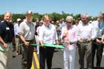 Massachusettes NRCS State Conservationist Christine Clarke (center) joins federal, state and local partners in cutting a ribbon celebrating the Sesuit Creek project