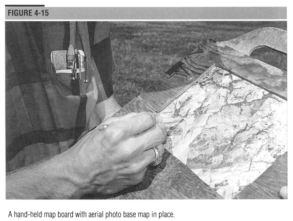 A hand-help map board with aerial photo base map in place.