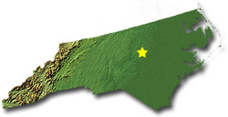 Image of North Carolina with a star pinpointing the location of the capital.