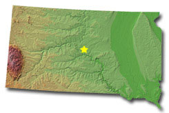 Image of South Dakota with a star pinpointing the location of the capital.