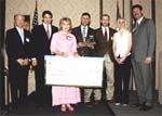 (from left) Texas Parks & Wildlife Commission Chairman Joe Fitzsimons; Texas Governor Rick Perry; Sue & Gary Price; Gary Price Jr., Jubilee Dickson; and David Allen of Sand County Foundation