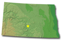 Image of North Dakota with a star pinpointing the location of the capital.
