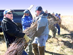 Don Dixon, Ag Director for U.S. Senator Mike Crapo joins NRCS and Tribal employees bundle a fascine for use in strengthening the Snake River’s banks