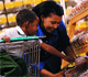 Picture of a mother and boy shopping for food.
