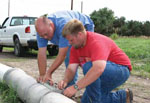 NRCS Water Quality Specialsist Curtis Scheele (left) trains Earth Team Volunteer