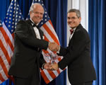 Photograph of EPA Deputy Administrator Marcus Peacock shaking hands with Hon. Michael W. Hager, Acting Director, U.S. Office of Personnel Management.