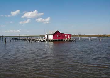 A waterman's shack on stilts over the water
