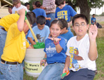 students from Odem Elementary dig in soil where they found earth worms rocks, roots, sea shells, and crop residue such as cotton, grain sorghum, and corn -- NRCS photo click to enlarge