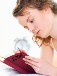 Girl writing in her 2008 journal
