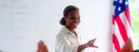 Schools: Picture of teacher in front of classroom