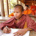 Photo of a novice monk who was orphaned by AIDS and is now receiving education at a temple in Cambodia (click to read about orphans and vulnerable children)