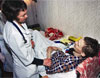 Photo: In a St. Petersburg AIDS center, a doctor consults with a patient (Click here to read full story).
