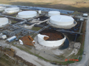 Aerial view of damaged oil tanks.