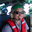 Female GIS Analyst in helicopter.