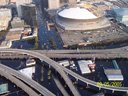 Aerial view of New Orleans Superdome and surrounding flooded streets.