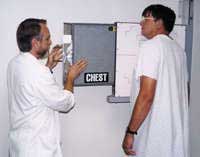 A patient performs a pulmonary function test