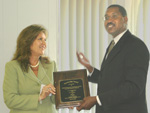 RC&D Council President Martha Watts presents award to Mississippi NRCS State Conservationist Homer Wilkes (NRCS photo -- click to enlarge)