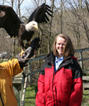 Regional Assistant Chief for the NRCS Central Region Christina Muedeking poses next to an eagle from the National Eagle Center in Wabasha, Minnesota (NRCS photo — click to enlarge)