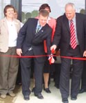  NRCS Senior Advisor to the Chief Michael Sanders (center), and Rural Development Chief of Staff, Washington, DC Jim Fitzgerald cut the ribbon at the new USDA Service Center facility in Bangor, Maine, as local, State and Federal officials look on (NRCS photo -- click to enlarge)