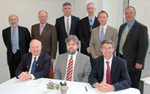 (MOU partners from left, front row) Steve Wenzel, USDA Rural Development; Duane Voy, USDA Risk Management; and Brad Moore, Minnesota Pollution Control Agency (back row) Al Levine, U of M College of Food, Agricultural and Natural Resource Sciences; Gene Hugoson, Minnesota Department of Natural Resources (MDA); John Beckwith NRCS; Mike Schmidt, U of M Extension; Perry Aasness, USDA Farm Service Agency; Mark Holsten, MDA (NRCS photo – click to enlarge)  