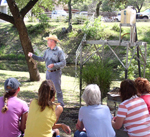 Phillip Wright, Grazing Lands Conservation Initiative coordinator in Hondo, gives a water-capturing demonstration with the rainfall simulator  (NRCS photo)