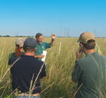 U.S. Geological Survey botanist Larry Allain discusses coastal prairie vegetation response on Gueydan Prairie WRP (NRCS image -- click to enlarge)