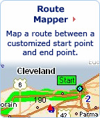 Route Mapper: Map a route between a customized start point and end point. Photo of a close up view of a map with a green route mapped.