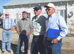 (from left) advisory committee members and guest Joel Douglas, Mike Odegard, Bob Jones and John McLain tour historical buildings at Great Basin PMC