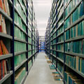 image of an aisle of a library stack