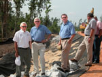 (from left) Billy Smith, Elder with the Poarch Band of Creek Indians and Manager of Magnolia Branch, a recreational facility owned by the Tribe; Dick Coombe, NRCS Regional Conservationist, East; and Gary Kobylski, Alabama NRCS State Conservationist view stabilization of side ditches along roads that run through the Tribal land (NRCS photo)