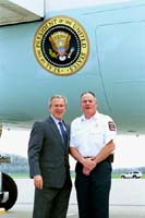 President George W. Bush met Patrick Leonard upon arrival in Hershey, Pennsylvania, on Monday, April 19, 2004.  Leonard is an active volunteer with the Hershey Volunteer Fire Company.   