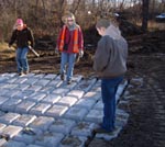 (from left) Mitch Cabek, IMPACK6 (stands for the six SWCDs in the Technical Service Area for Non-point Engineering Assistance in Isanti, Mille Lacs, Pine, Aitkin, Chisago, and Kanabec Counties), Nicole Sternquist, IMPACK6; and Deb Hermel, NRCS meet to inspect installation 