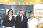 NHQ Legislative and Public Affairs Division intern Dena Bunnel, Secretary Johannes, and Indiana NRCS grassland conservationist Susannah Hole by the NRCS booth at the FFA Career Show in Indianapolis (NRCS photo)