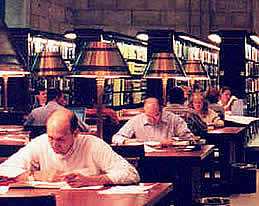 Photo: readers using the tables in the  Science and Business Reading Room.