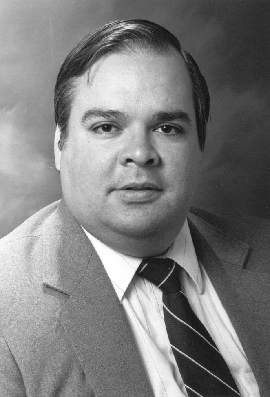 black-and-white head shot of Dr. James Ortiz