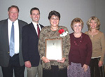 members of her leadership team help Jane celebrate at the awards ceremony (from left) Assistant State Conservationist for Programs Harold Thompson, State Resource Conservationist Shannon Zezula, Jane Hardisty, Executive Assistant Paula Mulligan, and State Administrative Officer Elana Cass (NRCS Photo)