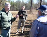participants listen to a Virginia Department of Forestry official discuss the benefits of managed pine plantings
