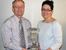 Nebraska NRCS State Conservationist Steve Chick presents the National Earth Team Volunteer Service Award Chief’s Cup to NRCS public affairs specialist Joanna Pope